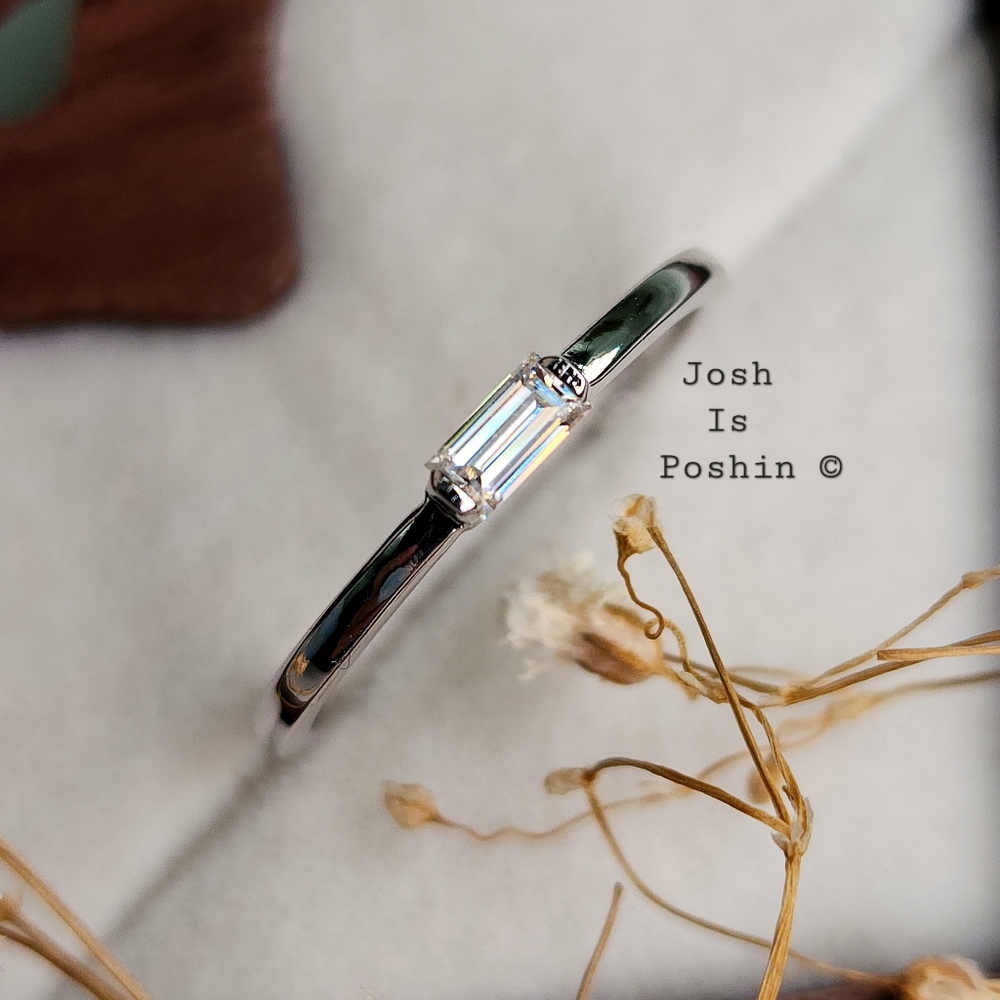 Bezel set emerald cut moissanite in 18k gold over sterling silver